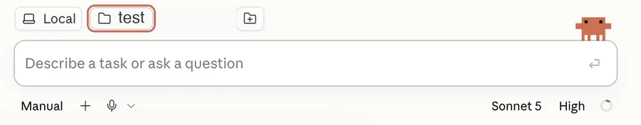 The bar around the message box: folder chip, Manual approval mode, microphone, model and effort setting